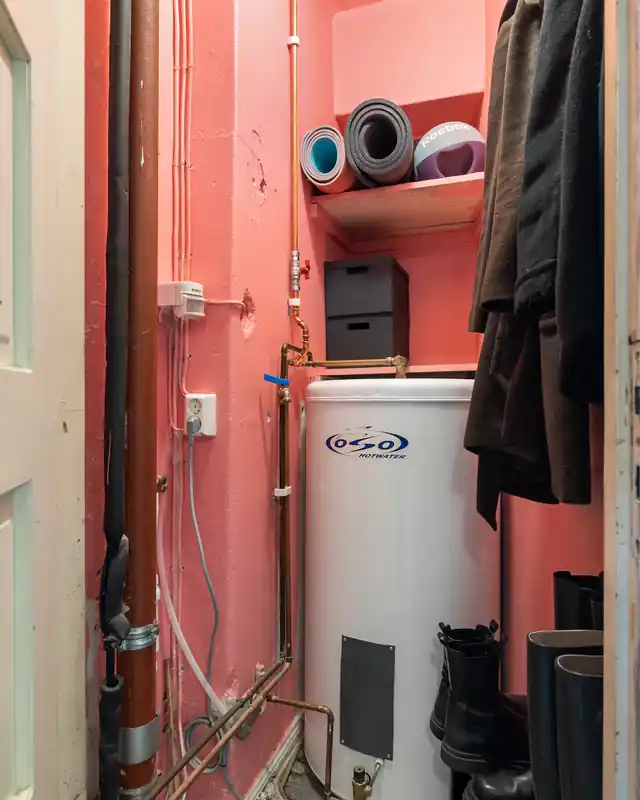 Tank water heater in a utility closet, a common spot for water heater leak repair in La Mirada