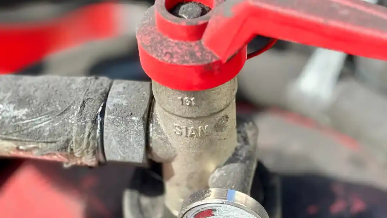 Close-up of a valve with a pressure gauge